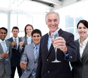 Happy diverse business group toasting with Champagne to celebrate a succes